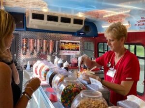 a woman serving ice cream to the customer